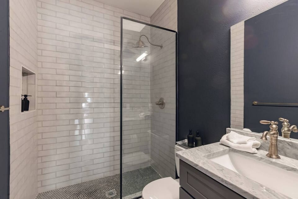 Spa-like bathroom with walk-in shower and rain shower head.