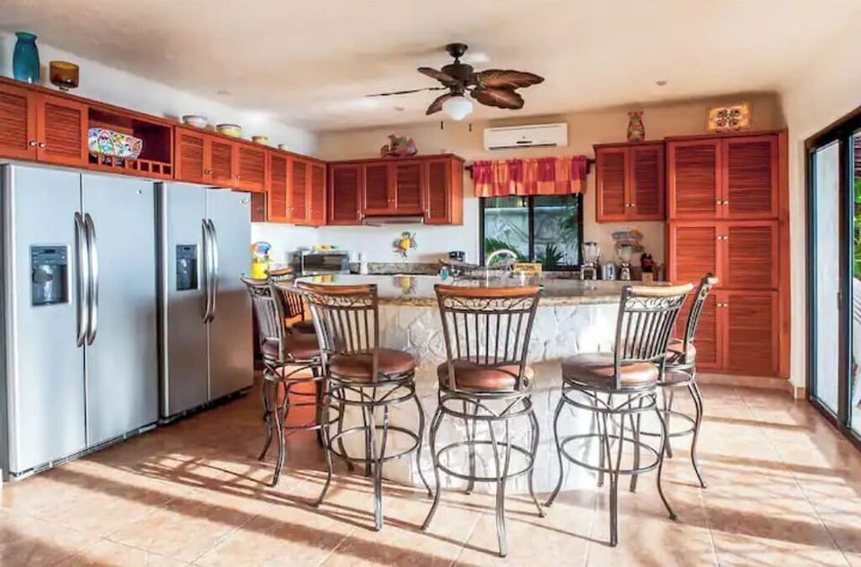 The kitchen is fully equipped with everything you need, including two fridges.