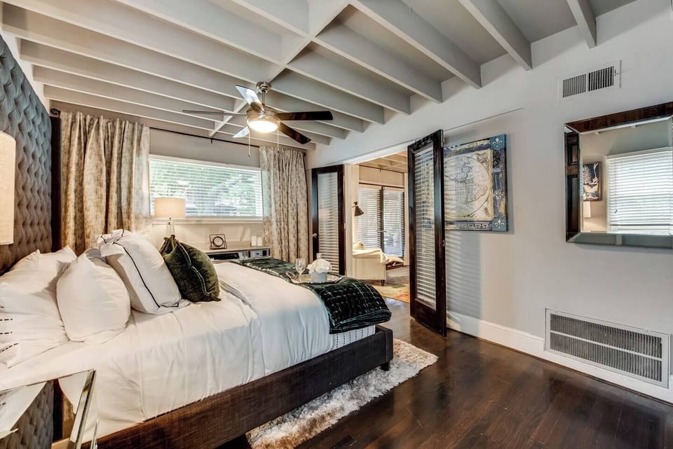 King bed with Egyptian Cotton Linens and hotel quality mattress. Guests regularly ask where to purchase this mattress. It's that comfy!