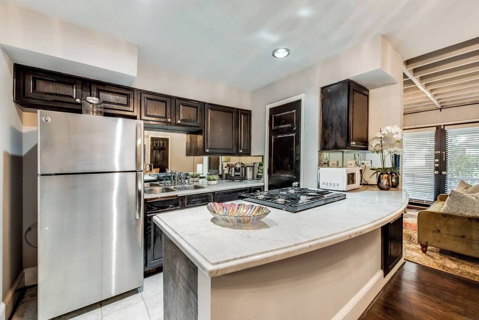 Kitchen with Nespresso Maker and Gas Stove.