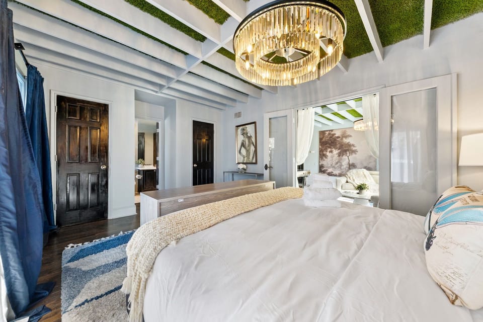 Primary Suite – King bed with hotel-quality mattress, crystal chandelier, and soft Egyptian cotton linens for restorative sleep.