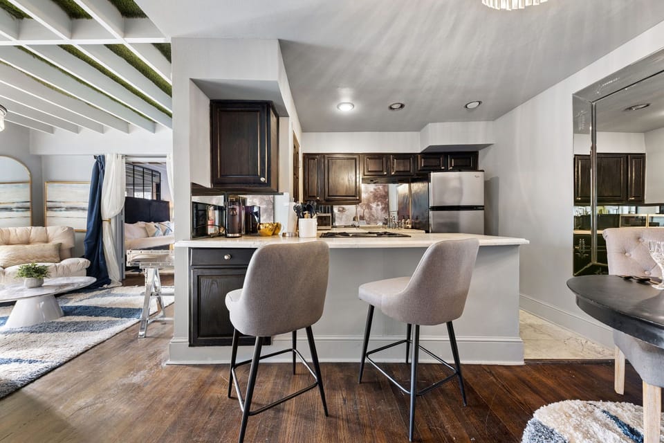 The modern dining room is the perfect spot to enjoy your morning coffee or savor a gourmet meal in style.