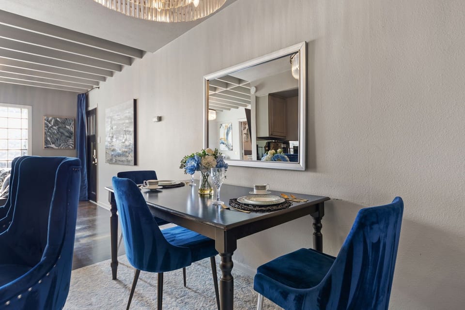 The dining area offers a stylish and comfortable space to enjoy meals, perfect for casual dining or entertaining guests during your stay.