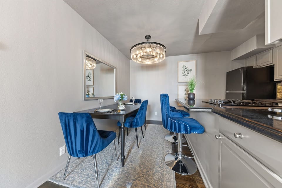 The dining area offers a stylish and comfortable space to enjoy meals, perfect for casual dining or entertaining guests during your stay.