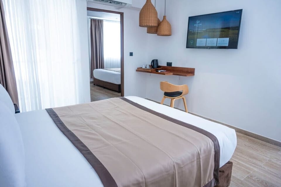 Family Room | Minibar, in-room safe, laptop workspace, iron/ironing board