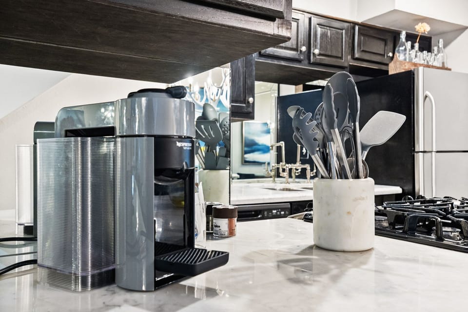 The spacious kitchen offers everything from essential cookware to modern appliances, making it perfect for both quick breakfasts and home-cooked meals.