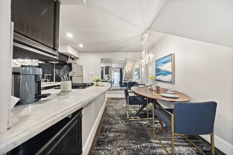 The spacious kitchen offers everything from essential cookware to modern appliances, making it perfect for both quick breakfasts and home-cooked meals.