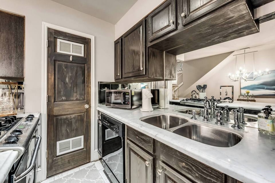 The kitchen is fully equipped with all the essentials and modern appliances, making it perfect for preparing meals with ease and convenience.