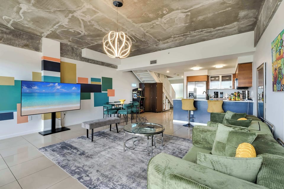 Catch your favorite shows on the large Smart TV or enjoy the vibrant, art-filled atmosphere.