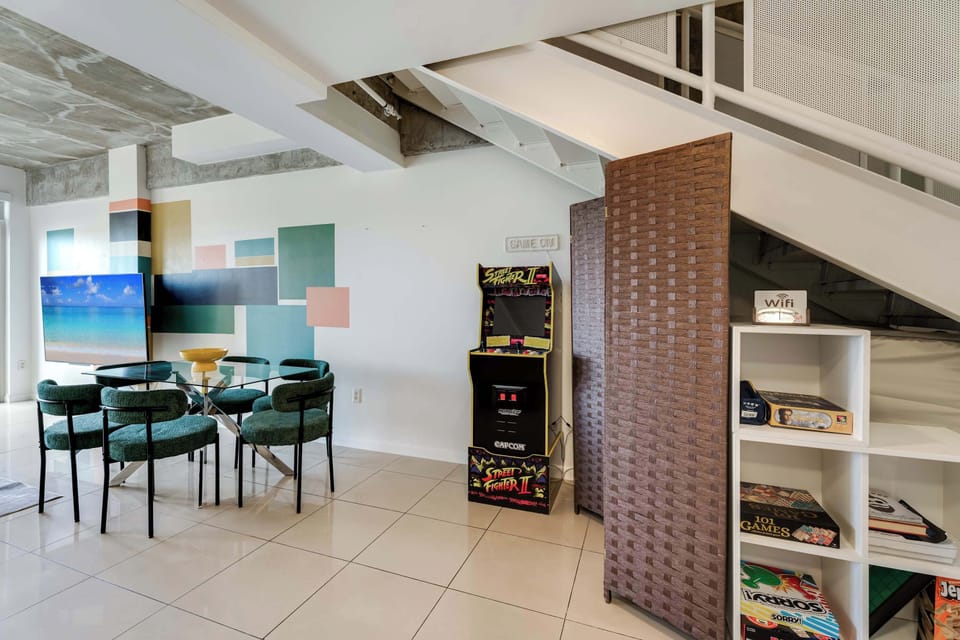 Enjoy dinner with a side of nostalgia! Our dining area sits right next to the private arcade machine.