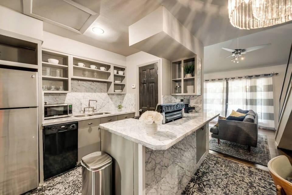 Kitchen with gas range, Nespresso machine, microwave and all appliances/kitchen essentials.
