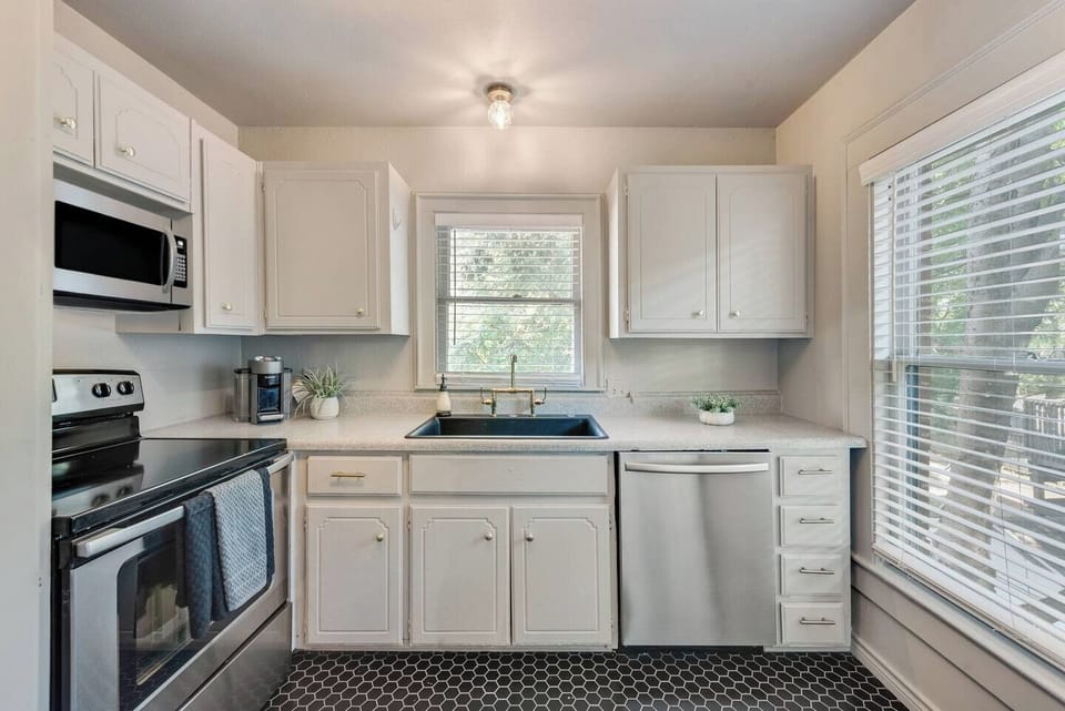 The kitchen is fully equipped with all the essentials and modern appliances, making it perfect for preparing meals with ease and convenience.