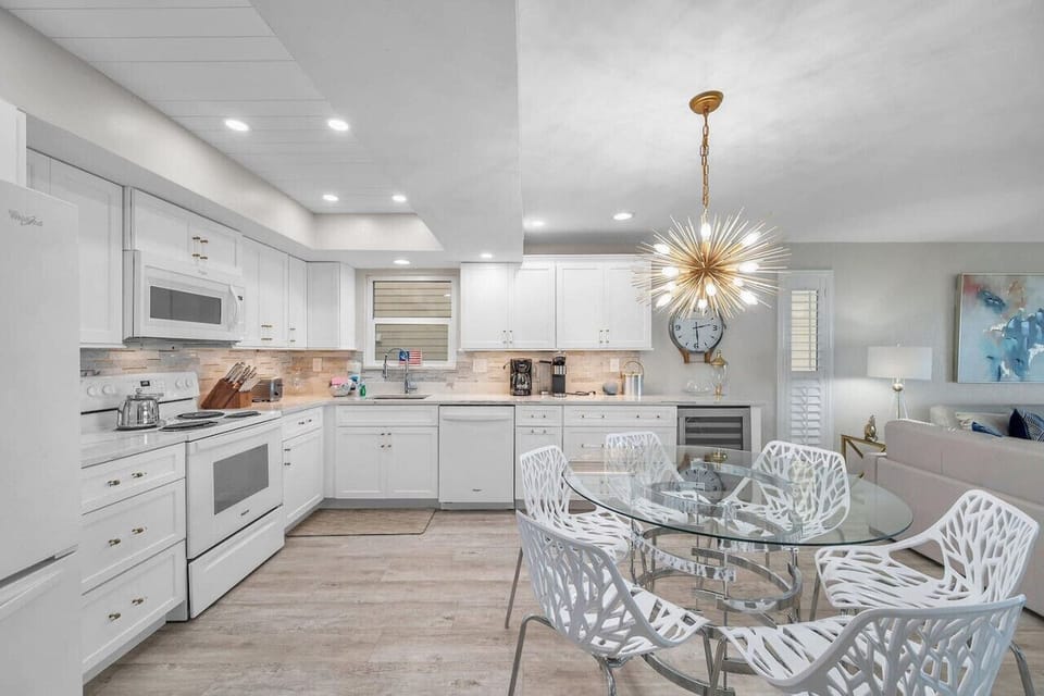 Modern kitchen w/ generous counter space and seating, great for casual meals and conversation.