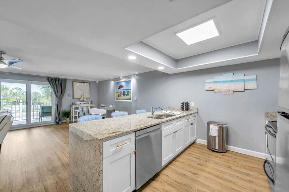 Open-concept kitchen w/ island seating & easy flow to living areas.