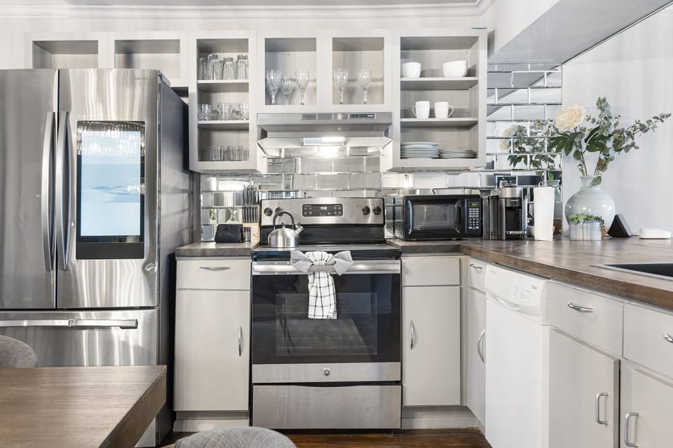 Full kitchen with stainless range and everyday essentials