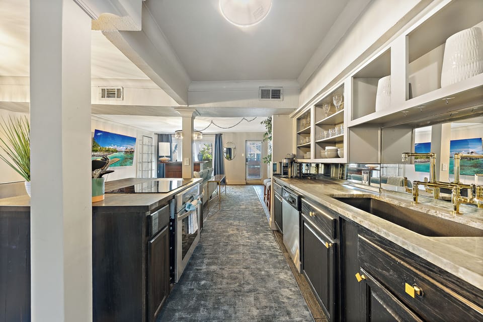 Spacious open floor plan with a large kitchen island, perfect for cooking and gathering with friends and socializing 