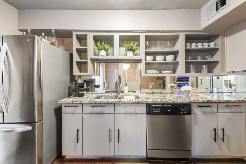 Spacious kitchen with sleek, modern appliances, fully equipped for all your cooking and dining needs.
