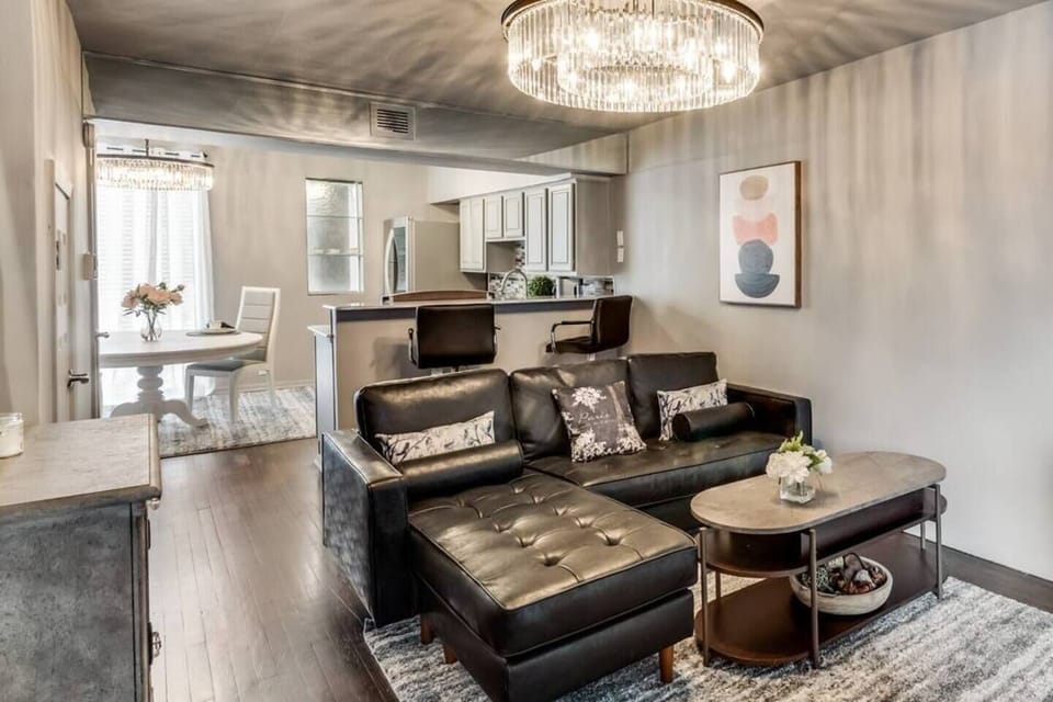 The spacious open floor plan creates a seamless flow between living, dining, and kitchen areas, offering a bright and airy atmosphere perfect for both relaxation and entertaining.