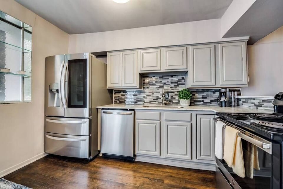 Spacious kitchen with sleek, modern appliances, fully equipped for all your cooking and dining needs.