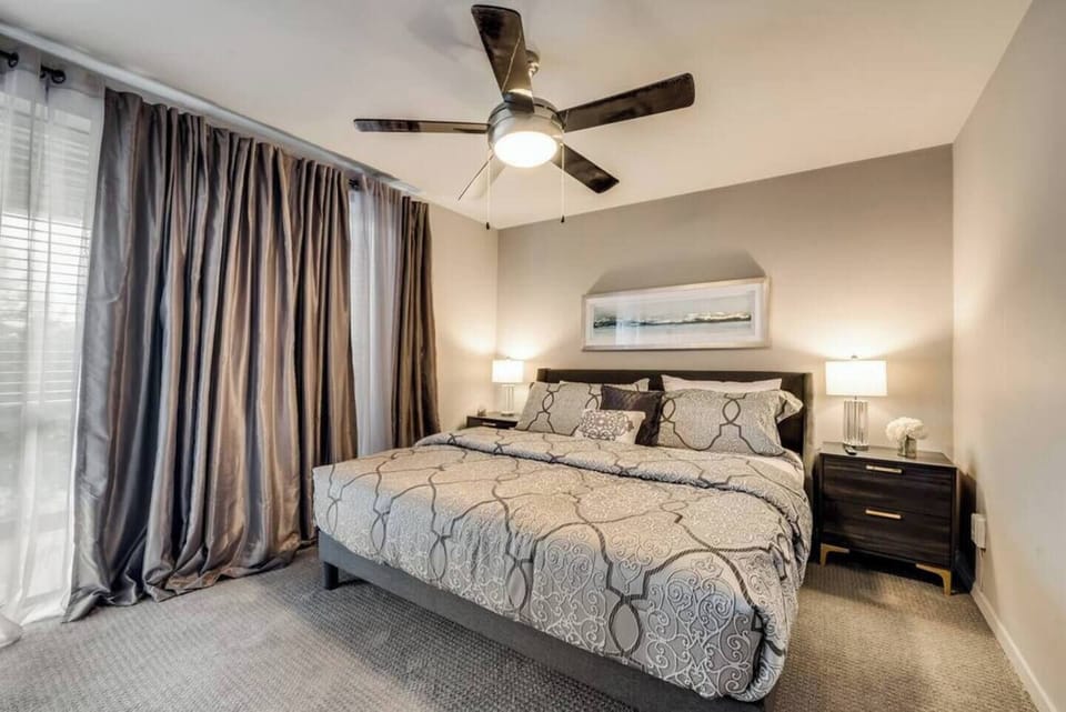 The primary bedroom, features a spacious king bed for a restful night’s sleep.