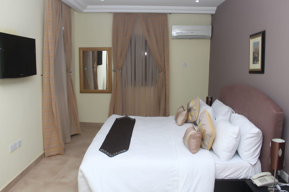Desk, laptop workspace, bed sheets
