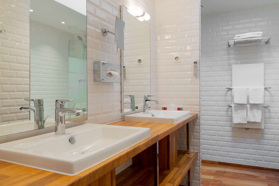Apartment - Complimentary soft minibar,courtesy tray, Chromecast and digital press | Bathroom | Free toiletries, hair dryer, towels