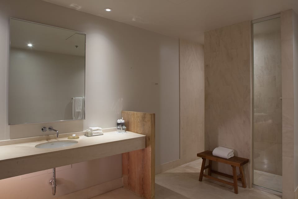 Designer toiletries, hair dryer, bathrobes, towels