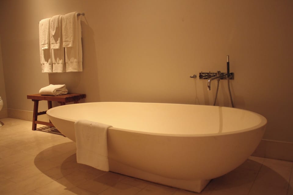 Designer toiletries, hair dryer, bathrobes, towels