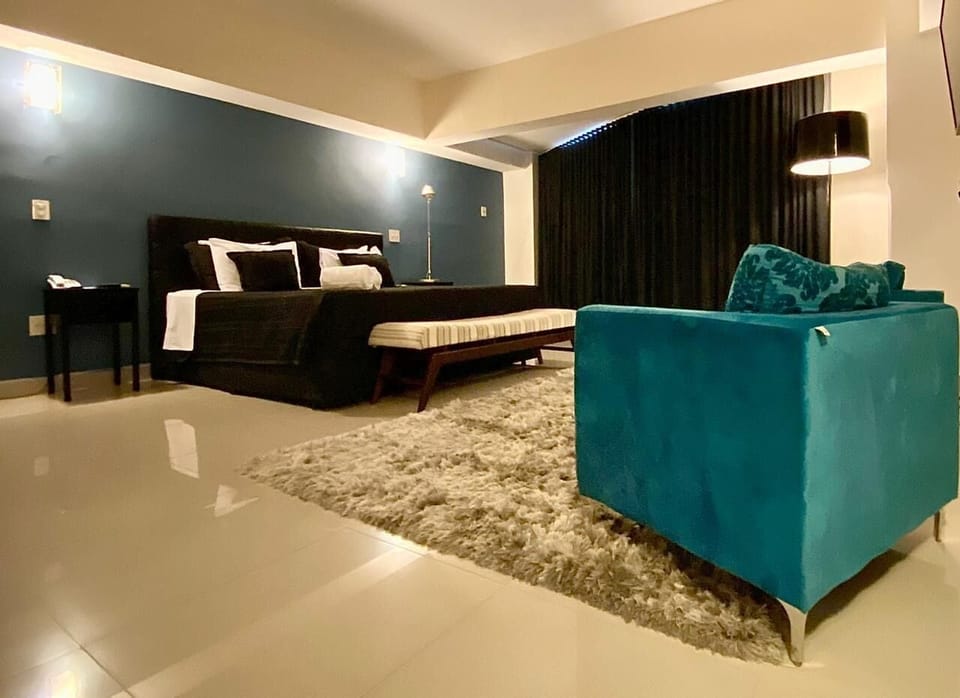 Luxury Suite | Minibar, desk, laptop workspace, blackout drapes