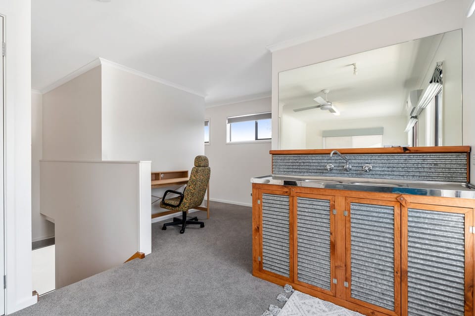 Upstairs workspace with sink nearby
