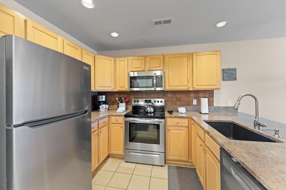 Your fully equipped kitchen awaits with granite counters, stainless appliances, and everything you need to create memorable meals during your stay.