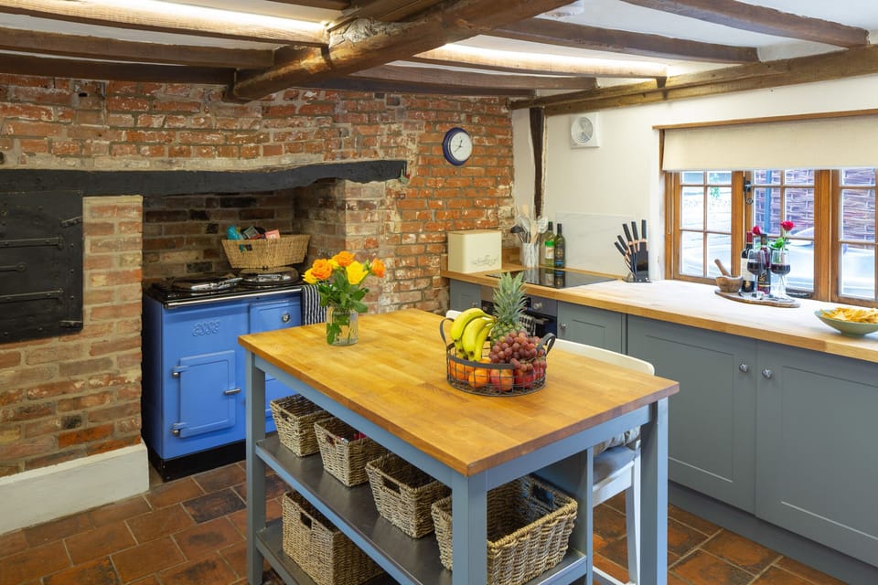 The cottage's kitchen includes an oak top breakfast bar