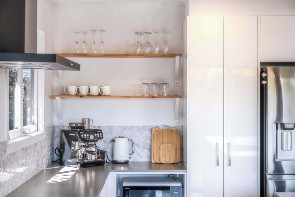 The coffee machine includes a milk steamer for homemade cappuccinos.