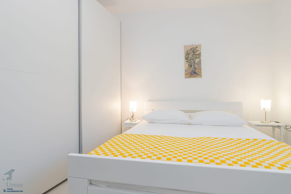 Bedroom with a queen sized bed and wardrobe closet