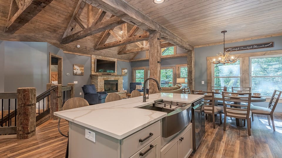 Kitchen. Upstairs living room. Dining room. 65" TV.