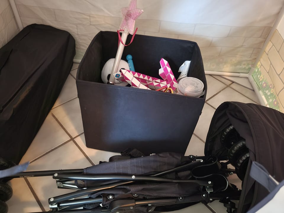 Toys, Portable Highchair, Stroller,  and Playpen in the Family Room