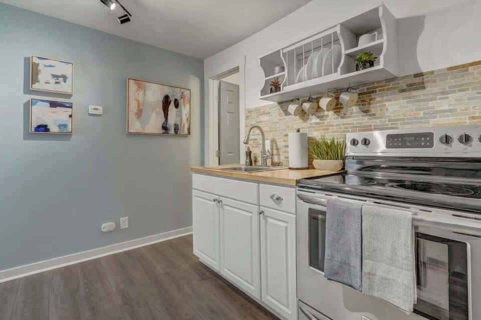 The kitchen is fully stocked with all the items needed to make a full meal comfortably to include pots/pans, spice rack, utensils, Keurig coffee maker, creamer, sugar, and so much more!