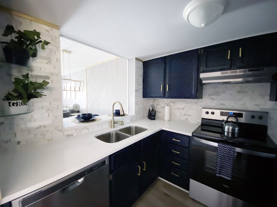 Kitchen with stainless steal appliances and quartz countertops