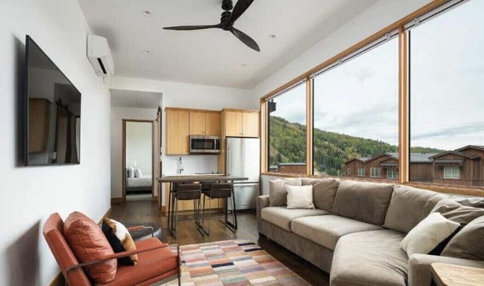 View of the living room and kitchenette area on the second floor of the home