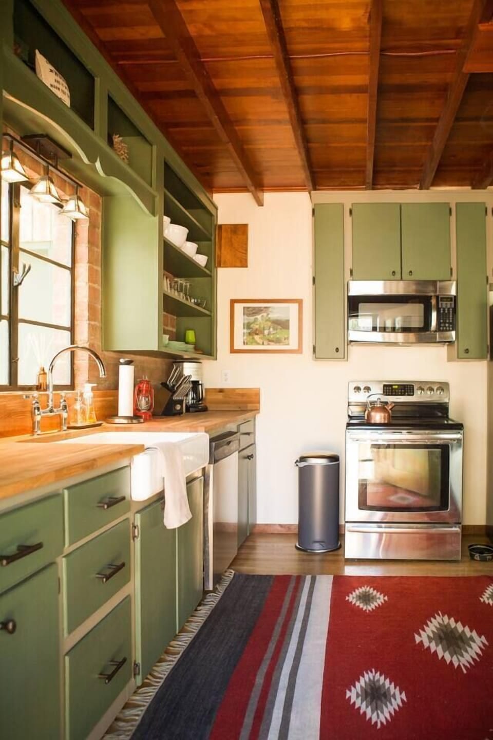 Well-stocked cabin kitchen with full-size modern appliances