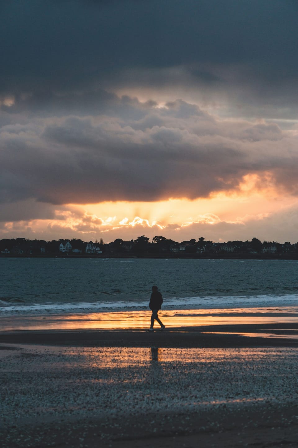 Golden footprints leading into sunset dreams