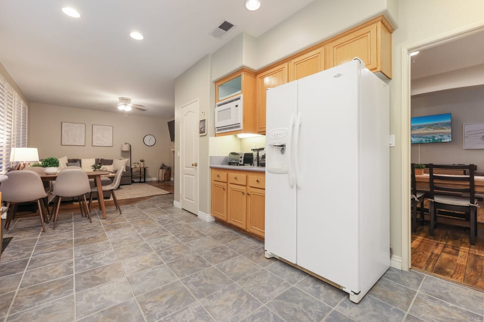 A small dining table is attached to the kitchen. Living room is also within sight. Great room!