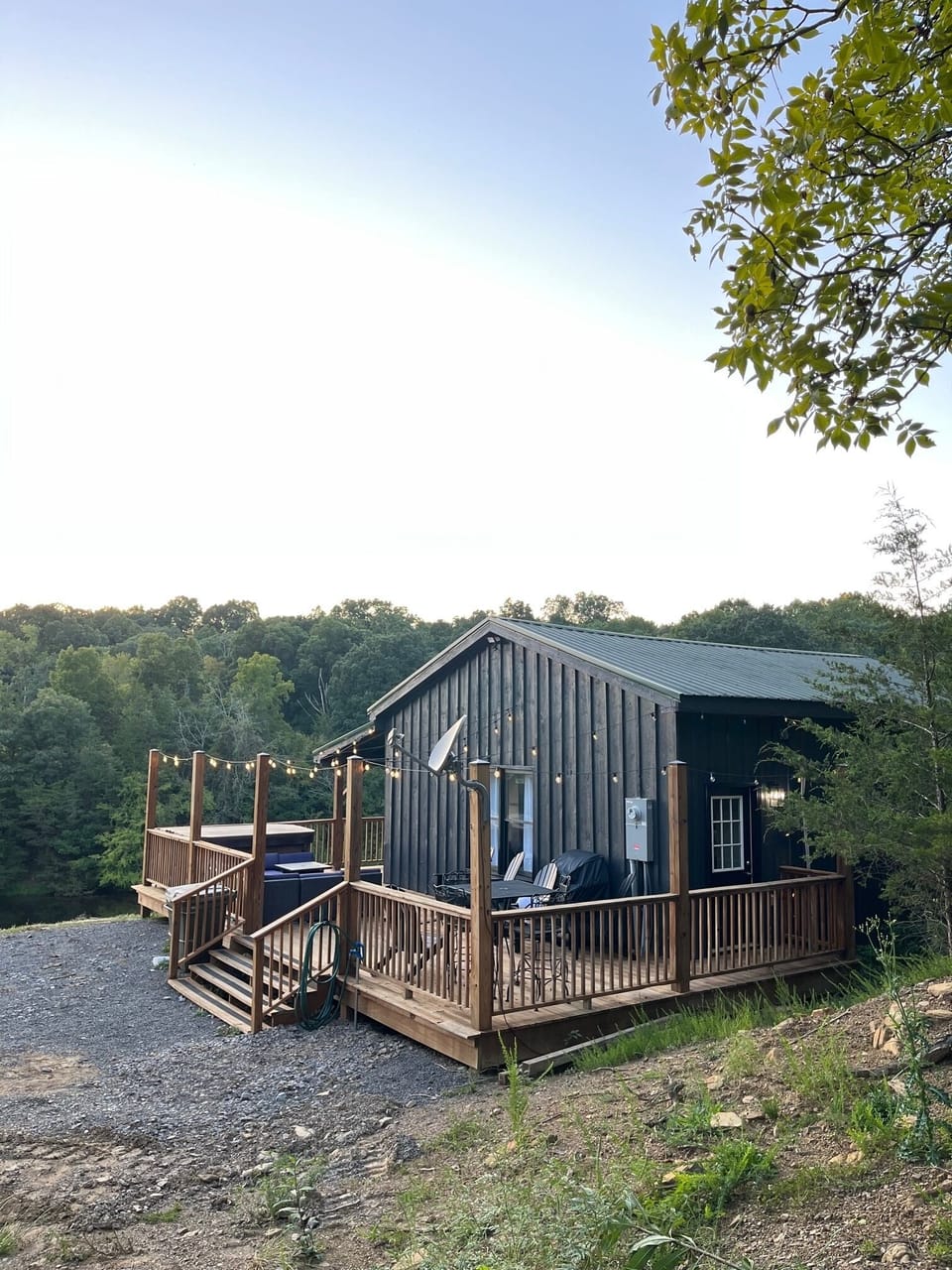 Outdoor dining table, sectional, propane fire pit, and hot tub