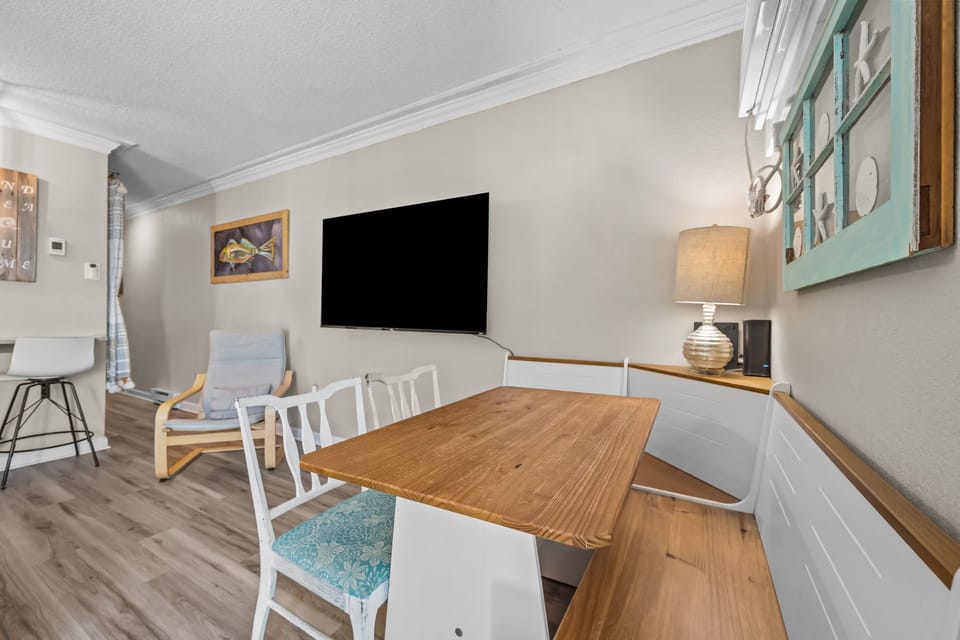 65" smart TV and dining nook