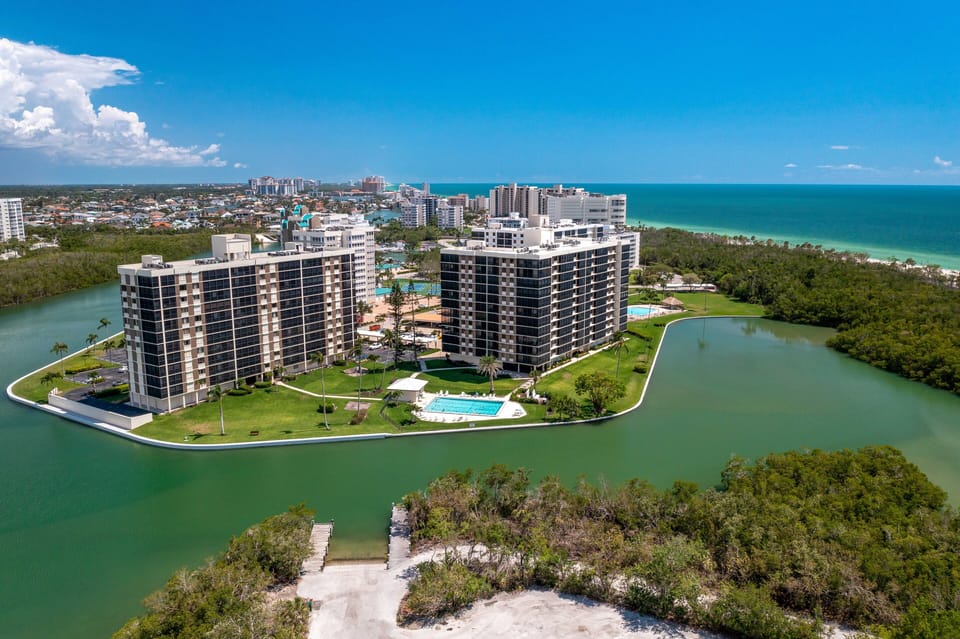 VSC801 - This unit is located on the 8th floor in building two of Vanderbilt Surf Colony (right building) and offers views of Delnor-Wiggins State Park and the Gulf of Mexico. Just a short walk to the beach.