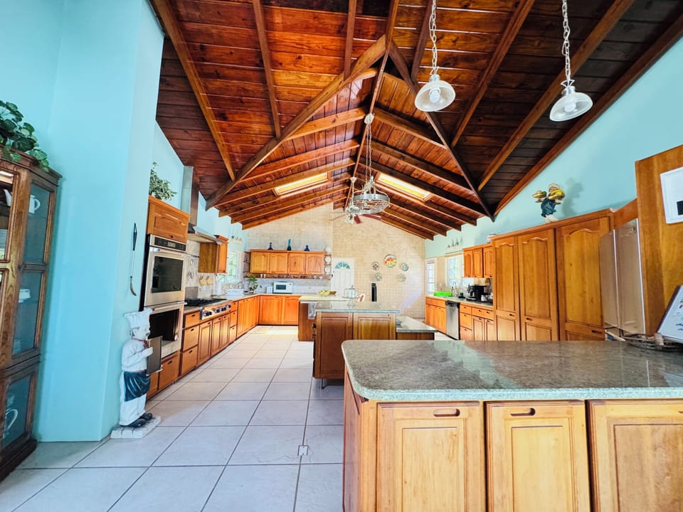 Over size kitchen with stainless steel appliances