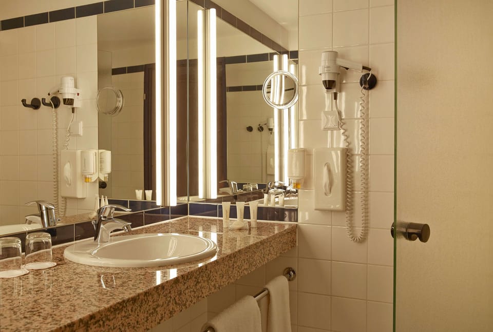Shower, eco-friendly toiletries, hair dryer, towels