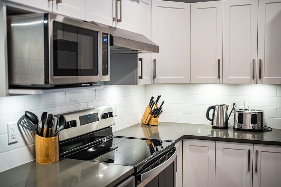 Orford Condo | Private kitchen | Coffee/tea maker, full-size fridge, microwave, oven