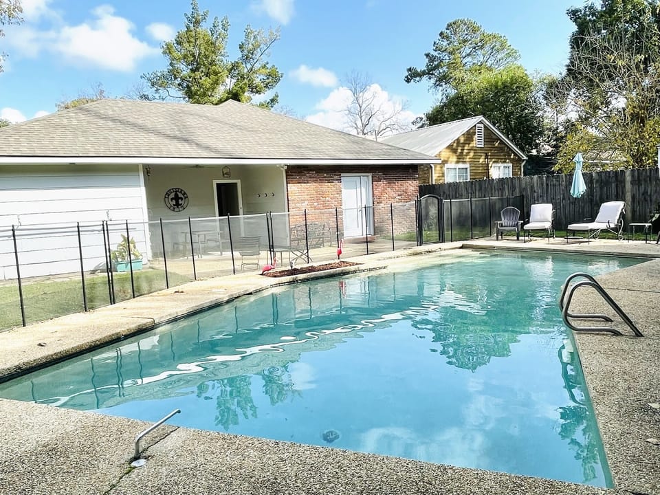 Relax in the private fully fenced gunite pool.