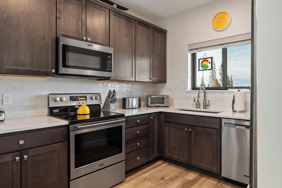 High End Appliances And Custom Granite Counter tops Throughout